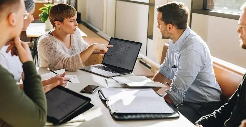 GroupOfPeopleWorkingDataGraphsNumbersOffice